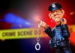 警察官の人形が手錠を持ってる画像
